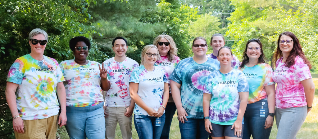 Nuspire Employees in Tie Dye Shirts